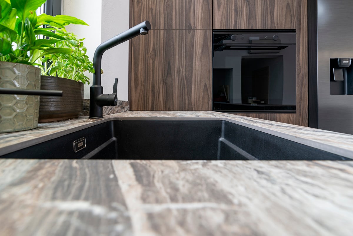 Black undermount sink with marble worktop