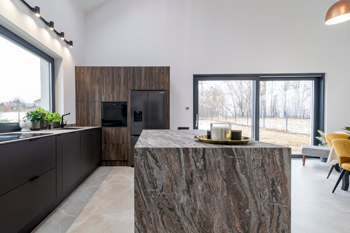Kitchen with marble island and garden sliding doors